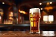 Glass of crisp cold lager beer on counter in pub for refreshing happy hour drink