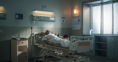 Hospital Ward: Portrait of Indian Elderly Man Wearing Oxygen Mask Sleeping in Bed, Recovering after Sickness and Successful Surgery. Senior Man Dreaming of His Family and Happy Healthy Life