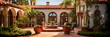 Mediterranean villa-inspired residential exterior featuring terra cotta roof tiles, arched windows, and a courtyard.