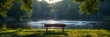 A bench on lush grass in a park by a river,
A wooden bench sits by a pond in a park.