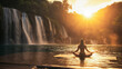 A woman is sitting in a yoga pose on a mat in front of a waterfall