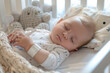 Baby sleeping with a wearable electronic device to monitor breathing and oxygen level 