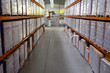 © Olga - Large warehouse with goods on shelves of racks.