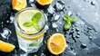 Soda water with lemon slices or citrus fruit and mint herbs