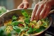 Detailed image showcasing the addition of fresh basil to a pan of aromatic Thai green curry