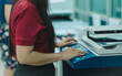 © Mdisk - businesswoman is using a printer or Photocopier in office businesses, employees rely on advanced photocopier and printer technology as essential office equipment