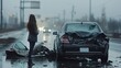 A devastated black sedan sits in the middle of a highway with its rear completely crushed on a dismal day