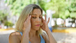 © Krakenimages.com - Young blonde woman suffering for headache at park