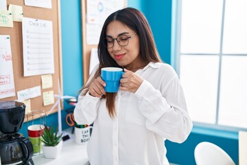 Poster - Young beautiful arab woman business worker smiling confident drinking coffee at office