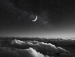 moon over the clouds in a black sky