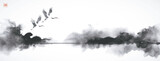 Fototapeta  - Ink painting of cranes flying over misty water in monochrome ink wash style. Traditional Japanese ink wash painting sumi-e. Translation of hieroglyph - zen