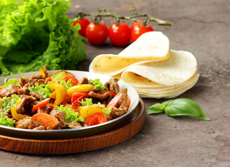 Sticker - traditional mexican dish fajitas meat with vegetables