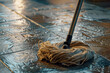 A close-up shot of a mop cleaning a tiled floor.