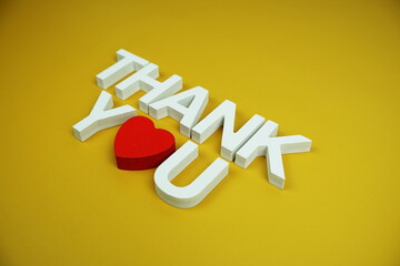 Sticker - Thank You alphabet letters top view on yellow background