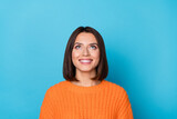 Fototapeta Panele - Portrait of attractive curious cheerful brown-haired girl looking up copy empty space clue isolated over bright blue color background