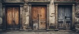 Vintage wooden doors with ornate carvings, set within the aged walls of an ancient structure, showcasing historical architecture