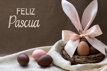 Poster - Happy easter text in spanish with basket with easter eggs and bunny bow.