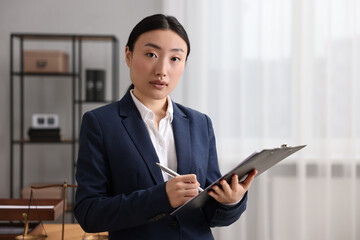 Canvas Print - Portrait of notary with clipboard in office