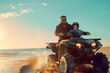 father and son riding an ATV on the beach