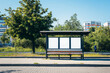 Small bus stop shelter with three empty transparent mockup copy spaces. Generative AI