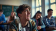 Teenage student crying among classmate laughing at them . Problems in teenagers at school .