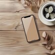 Smartphone on wooden desk with plant and leaves ideal for technology or lifestyle content