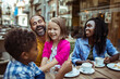 © Vorda Berge - Happy multiethnic family enjoying time at a cafe together