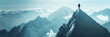 Man standing on snowy mountain peak panorama - A lone man stands contemplating on a snowy mountain peak with a panoramic view of the majestic mountain range