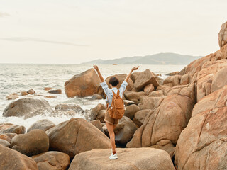 Sticker - Happy Traveler: Woman Backpacking by the Tropical Sea at Sunset, Enjoying a Carefree Summer Adventure