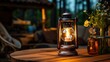 Antique kerosene lamp with lights on wooden table