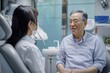 © darshika - Asian dentist discusses oral health with elderly patient