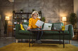 © Miljan Živković - mature caucasian woman use laptop computer at home for work on project