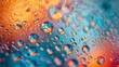 Close-up of water droplets on a warm-to-cool gradient surface. Vivid orange and blue gradient behind clear water beads. Textured backdrop of water droplets with contrasting color gradient.