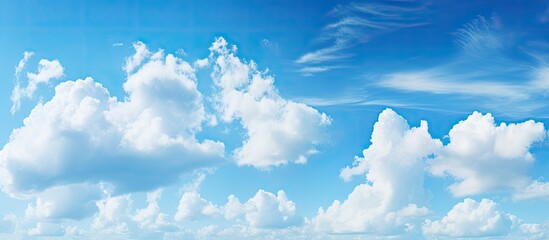 Wall Mural - a picturesque natural landscape with an electric blue sky filled with fluffy cumulus clouds. the hor