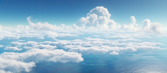 Wall Mural - observing the atmosphere from an airplane reveals a vast cloudy sky with cumulus clouds, creating a 