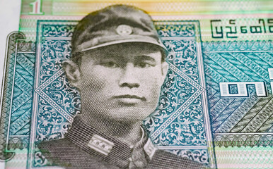 Portrait of General Aung San on Myanmar One Kyat currency banknote from 1972 (focus on center)