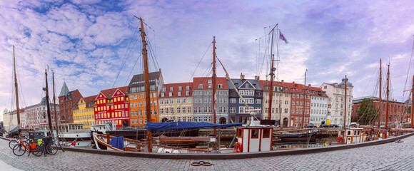 Wall Mural - Panorama of Nyhavn with colorful facades of old houses and ships in Old Town of Copenhagen, Denmark.