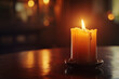 Warm and Inviting Atmosphere with a Single Candle Burning on a Wooden Table in a Cozy Room
