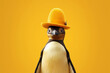 a pinguin in a yellow dress hat