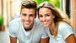 Man and Woman Posing in White T-Shirts Leaning Forward Smiling at Camera