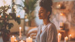 a serene indoor setting where a woman is enjoying the gentle glow of multiple candles, creating a peaceful and cozy ambiance.  a moment of relaxation and self-care