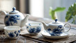 A serene porcelain tea set with a hand-painted blue floral motif.