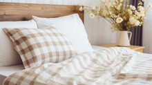Scandinavian Style Interior Design Of Modern Bedroom. Close Up Of Wooden Bed With Fringed Cream Plaid. Generative AI