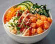 A salmon poke bowl colorfully arranged with fresh vegetables