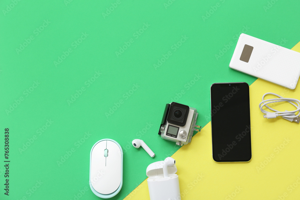 Composition with different modern gadgets on color background