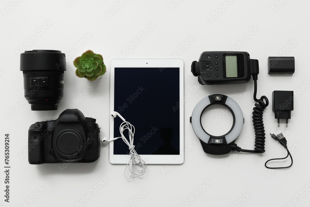 Composition with different modern gadgets on light background