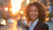 © 沈军 贡 - Happy wealthy rich successful businesswoman standing in big city modern skyscrapers street on sunset thinking of successful future vision, dreaming of new investment opportunities
