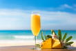 Hawaiian mimosas cocktail on table on beach against blue sky and gold sand