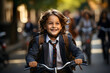 Happy ethnic child schoolboy in a helmet and with a briefcase rides a bike to school