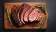 Roast beef with spices and rosemary. top view